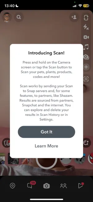 Hold your finger on the camera screen to activate the scanning feature.